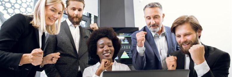 Business team celebrating a successful technology upgrade project in the office