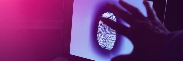 Hand interacting with fingerprint on a digital screen for biometric access