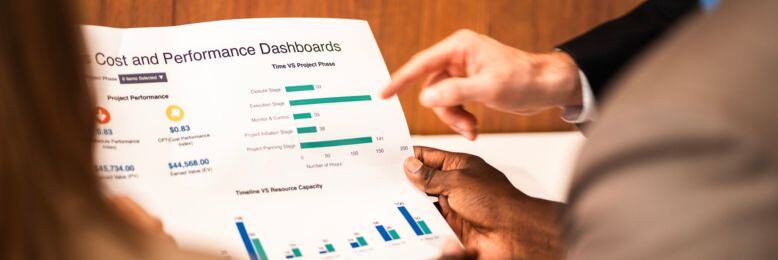 Professionals reviewing cost and performance dashboards, measuring the value of their MSP