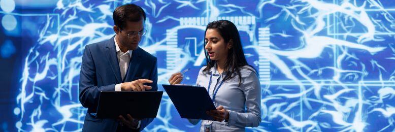 Two professionals discussing AI strategies with Microsoft Copilot visualized in the background